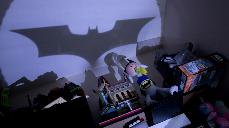 It’s not Batman, but close enough. It’s shining over a Lego movie theater, so Bruce is probably hanging out in the alley.